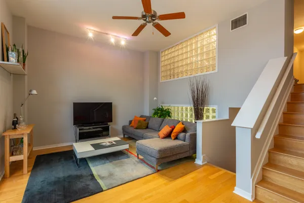 a bedroom with furniture and a flat screen tv