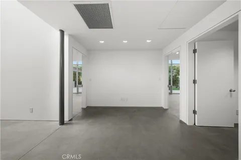 a bathroom with a sink mirror vanity and toilet