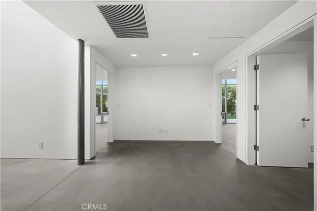 a bathroom with a sink mirror vanity and toilet