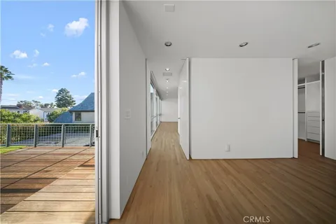 a view of balcony with wooden floor