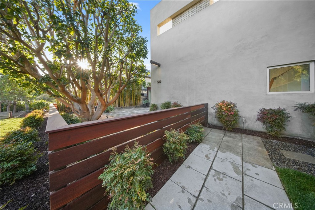 519 Santa Ana Avenue Newport Beach, CA 92663 - Photo 3 of 39 a wooden bench sitting in front of a house