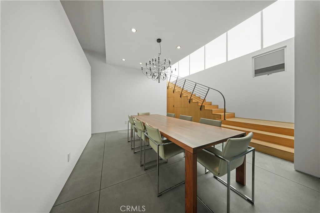 519 Santa Ana Avenue Newport Beach, CA 92663 - Photo 7 of 39 a room with table chairs and wooden floor