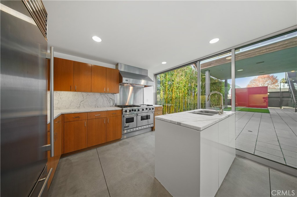 519 Santa Ana Avenue Newport Beach, CA 92663 - Photo 9 of 39 a kitchen that has a sink and a stove