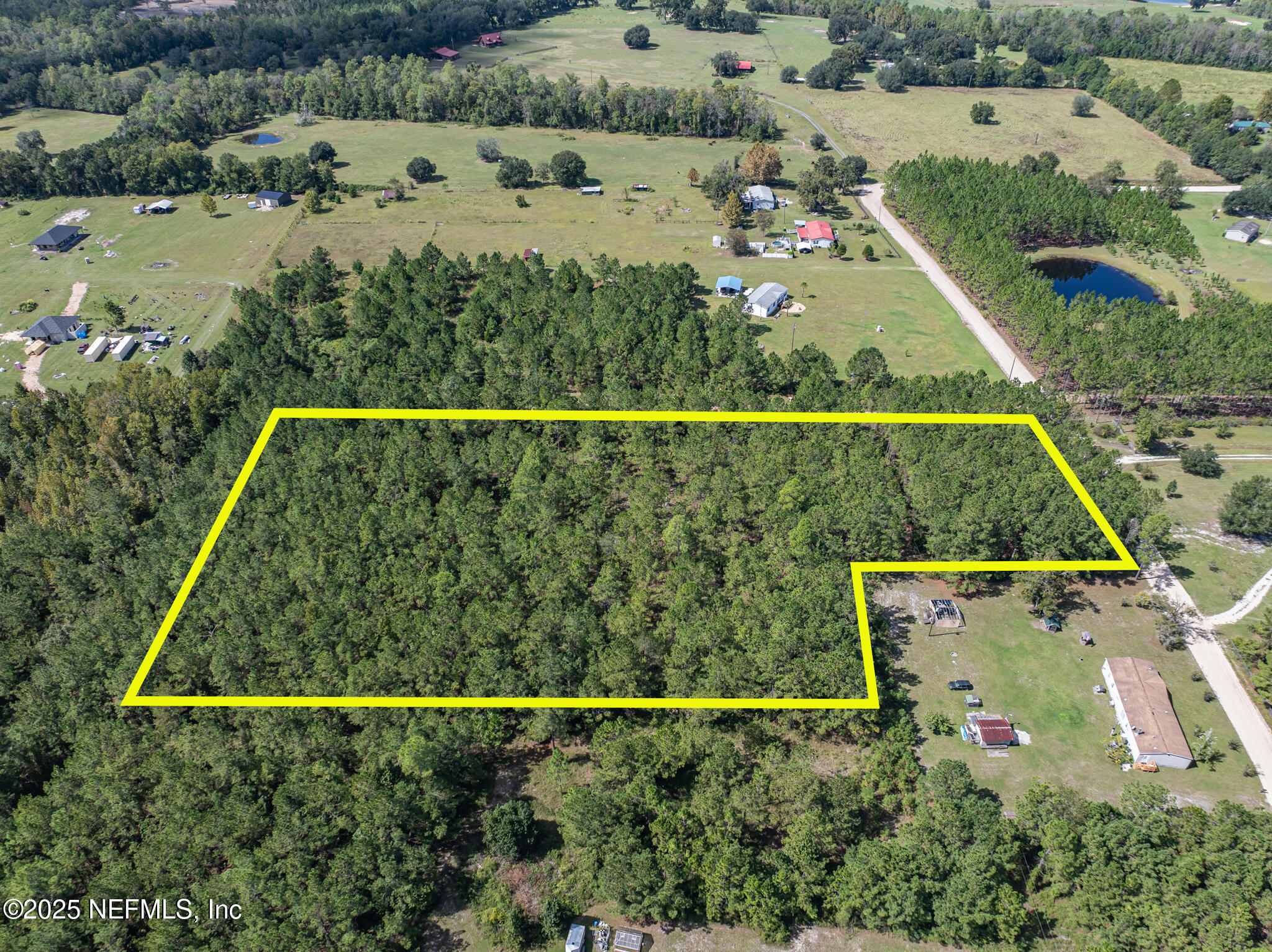 0 Broken Arrow Road Hilliard, FL 32046 - Photo 4 of 15 an aerial view of a tennis court