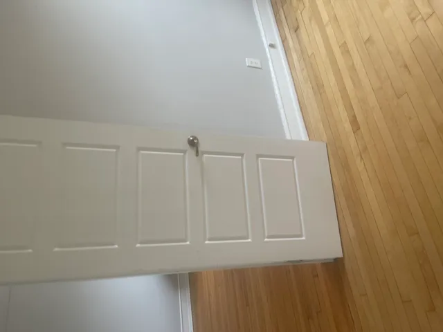 a view of staircase with white walls