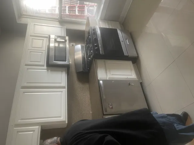 a bathroom with a shower and a sink