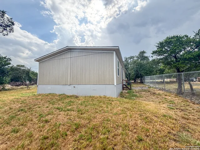 a view of backyard and tree