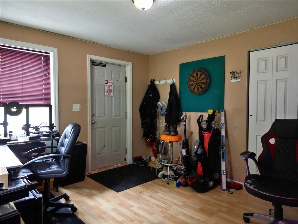 1119 Layton Road Butler, PA 16001 - Photo 2 of 25 a view of a workspace with furniture and gym equipment