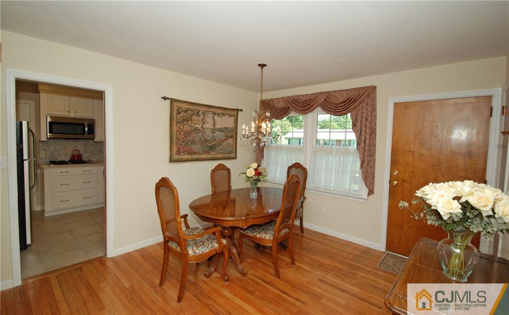 25 Glen Gary Road Middlesex, NJ 08846 - Photo 4 of 21 a dining room with furniture window and wooden floor