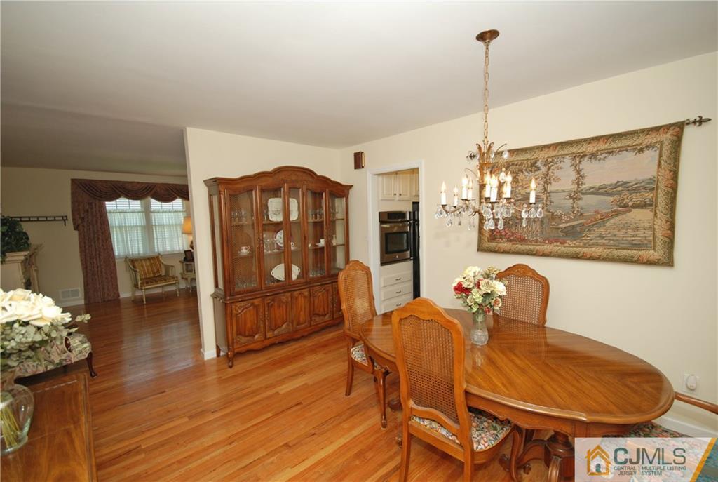 25 Glen Gary Road Middlesex, NJ 08846 - Photo 5 of 21 a view of a dining room with furniture and wooden floor