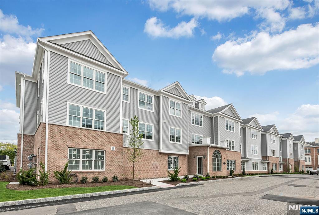 5201 Rio Vista Lane Northvale, NJ 07647 - Photo 1 of 38 a city street lined with buildings and trees