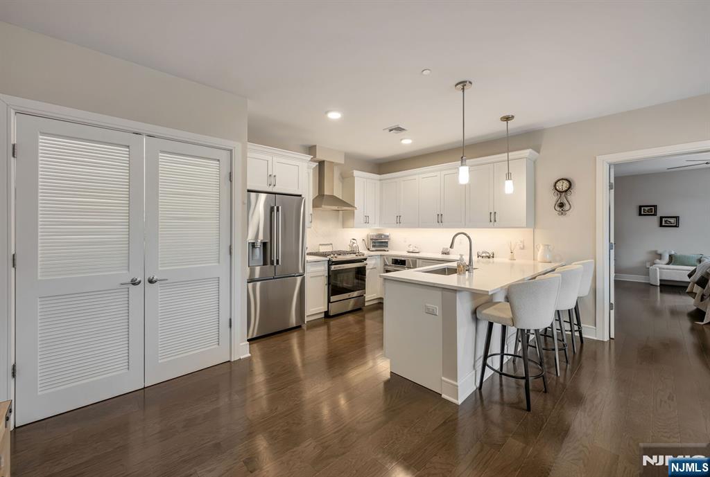 5201 Rio Vista Lane Northvale, NJ 07647 - Photo 2 of 38 a kitchen with a sink appliances and wooden floor