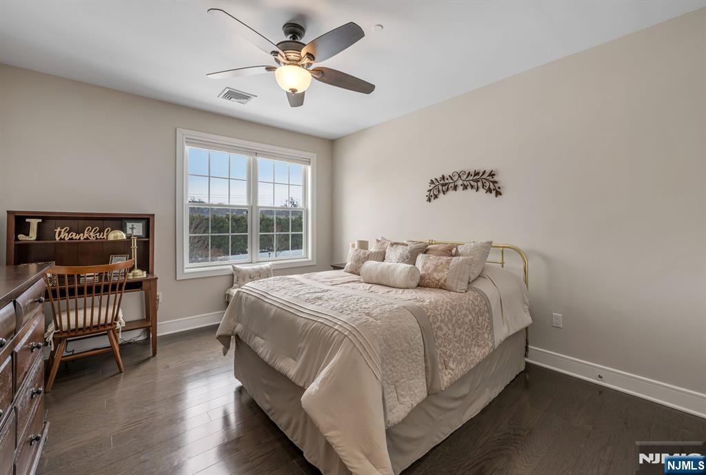 5201 Rio Vista Lane Northvale, NJ 07647 - Photo 21 of 38 a bedroom with a bed and a chair