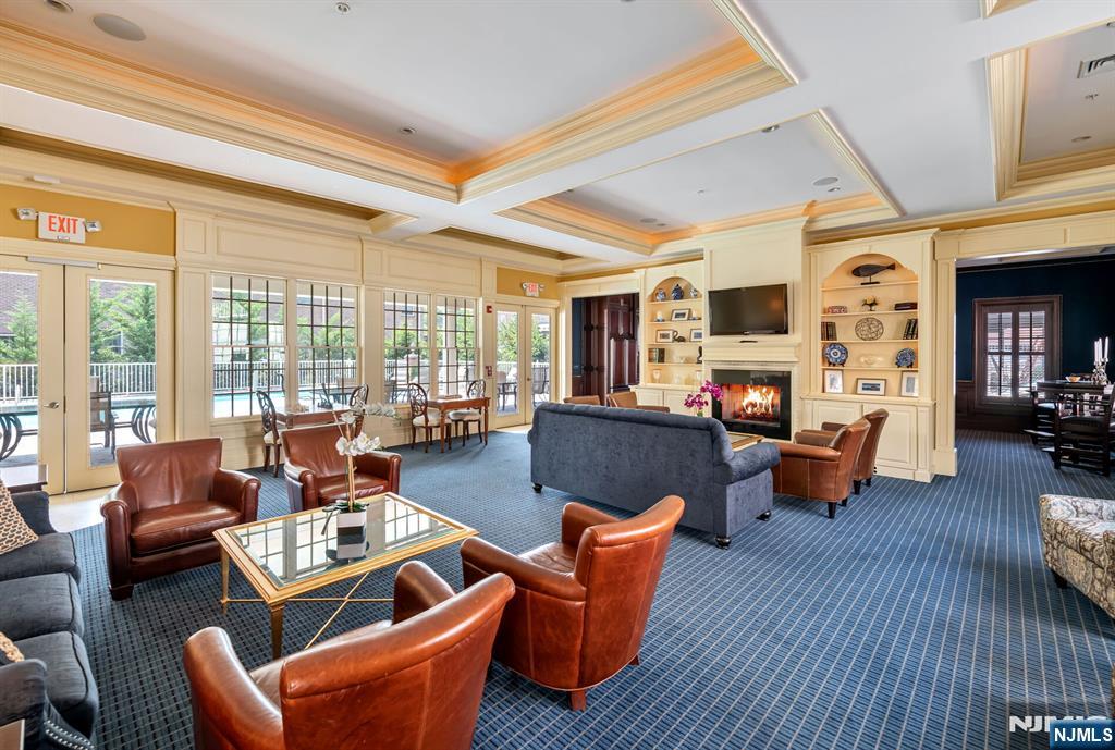 5201 Rio Vista Lane Northvale, NJ 07647 - Photo 26 of 38 a living room with furniture fireplace and a large window
