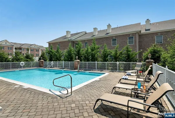 a view of a swimming pool with a deck