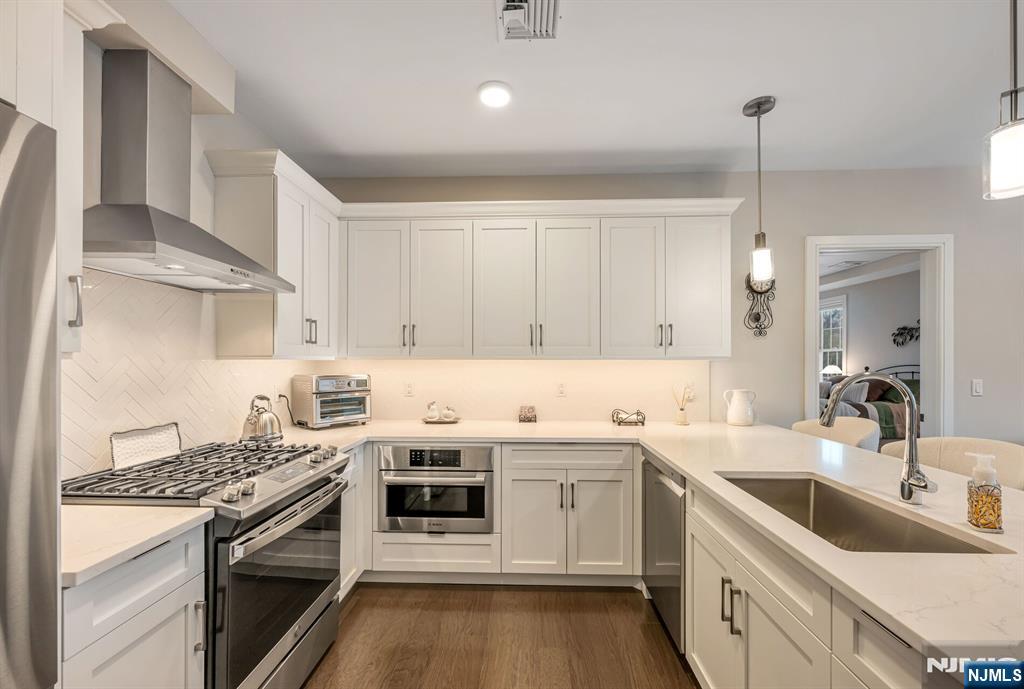 5201 Rio Vista Lane Northvale, NJ 07647 - Photo 3 of 38 a kitchen with a sink stove and cabinets