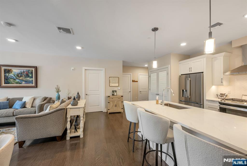 5201 Rio Vista Lane Northvale, NJ 07647 - Photo 7 of 38 a large kitchen with a table and chairs
