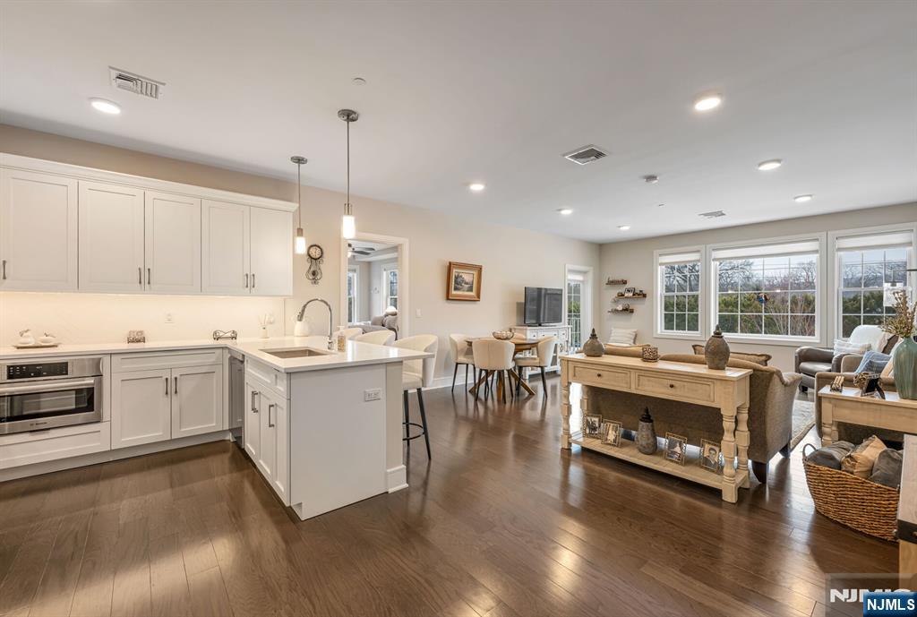 5201 Rio Vista Lane Northvale, NJ 07647 - Photo 9 of 38 a large white kitchen with a large window a sink and a stove