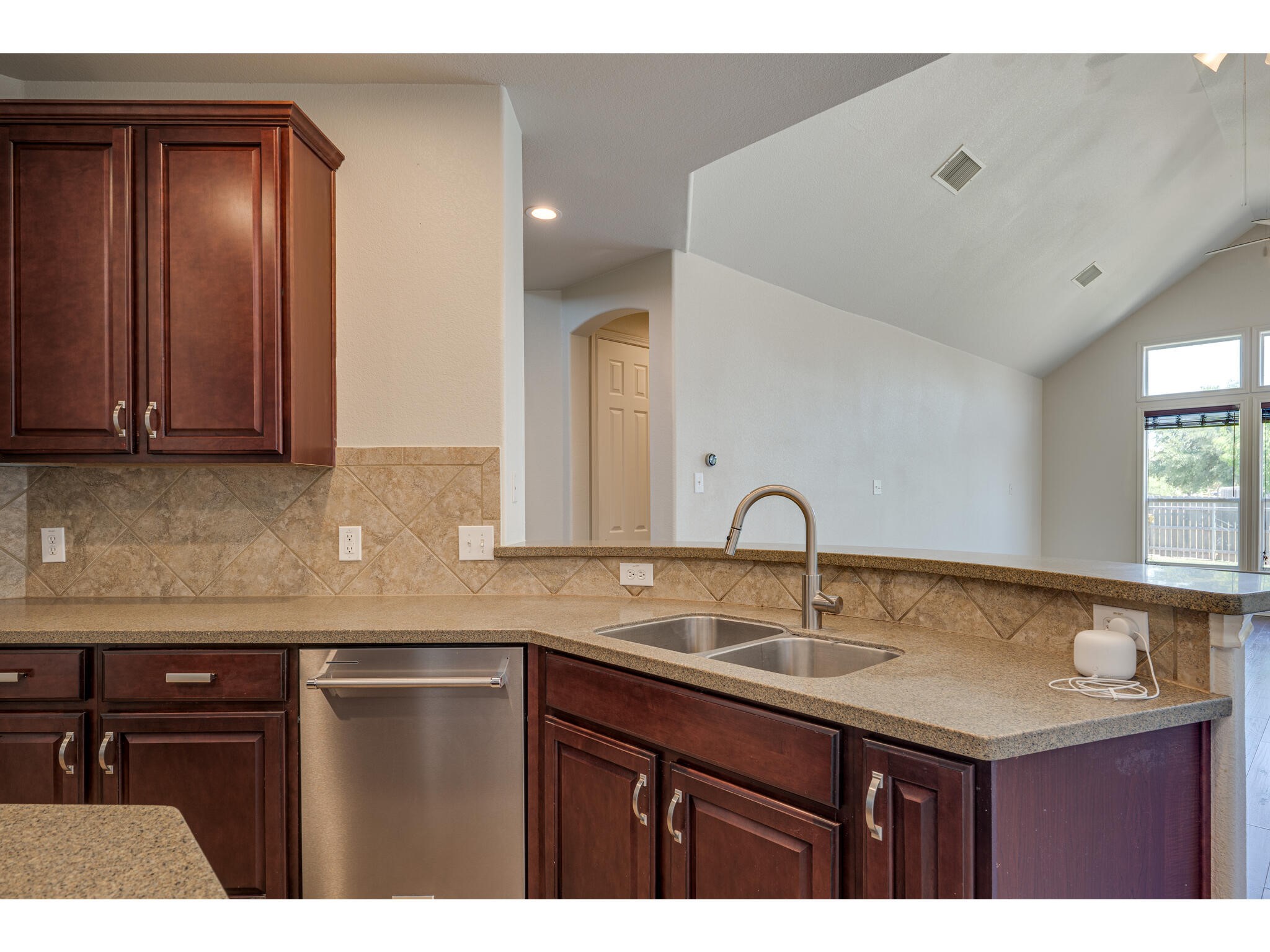 13925 Fallsprings Way Manor, TX 78653 - Photo 18 of 39 a kitchen with a sink and cabinets
