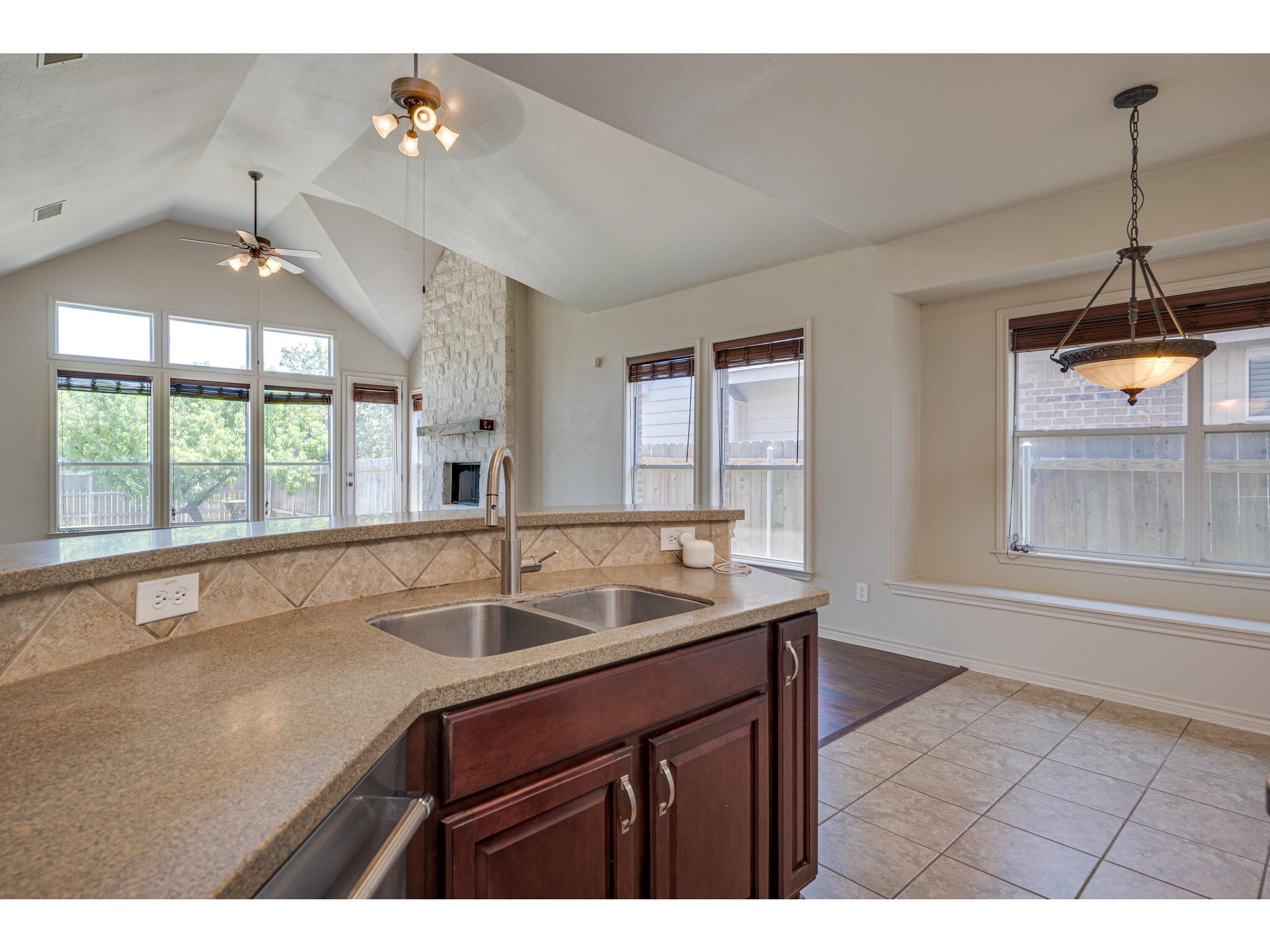 13925 Fallsprings Way Manor, TX 78653 - Photo 20 of 39 a kitchen with a sink and large window
