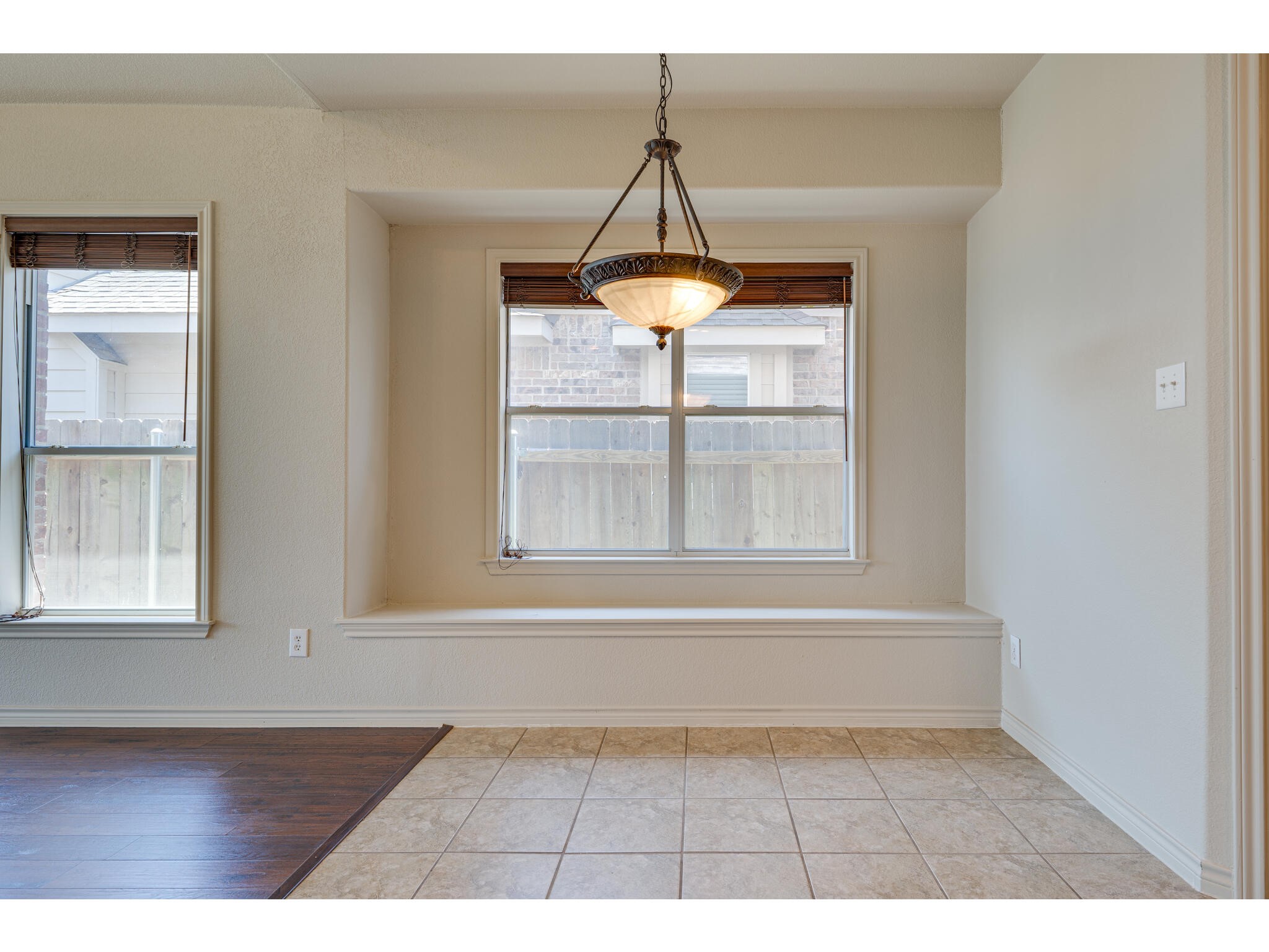 13925 Fallsprings Way Manor, TX 78653 - Photo 21 of 39 a view of empty room with wooden floor and fan