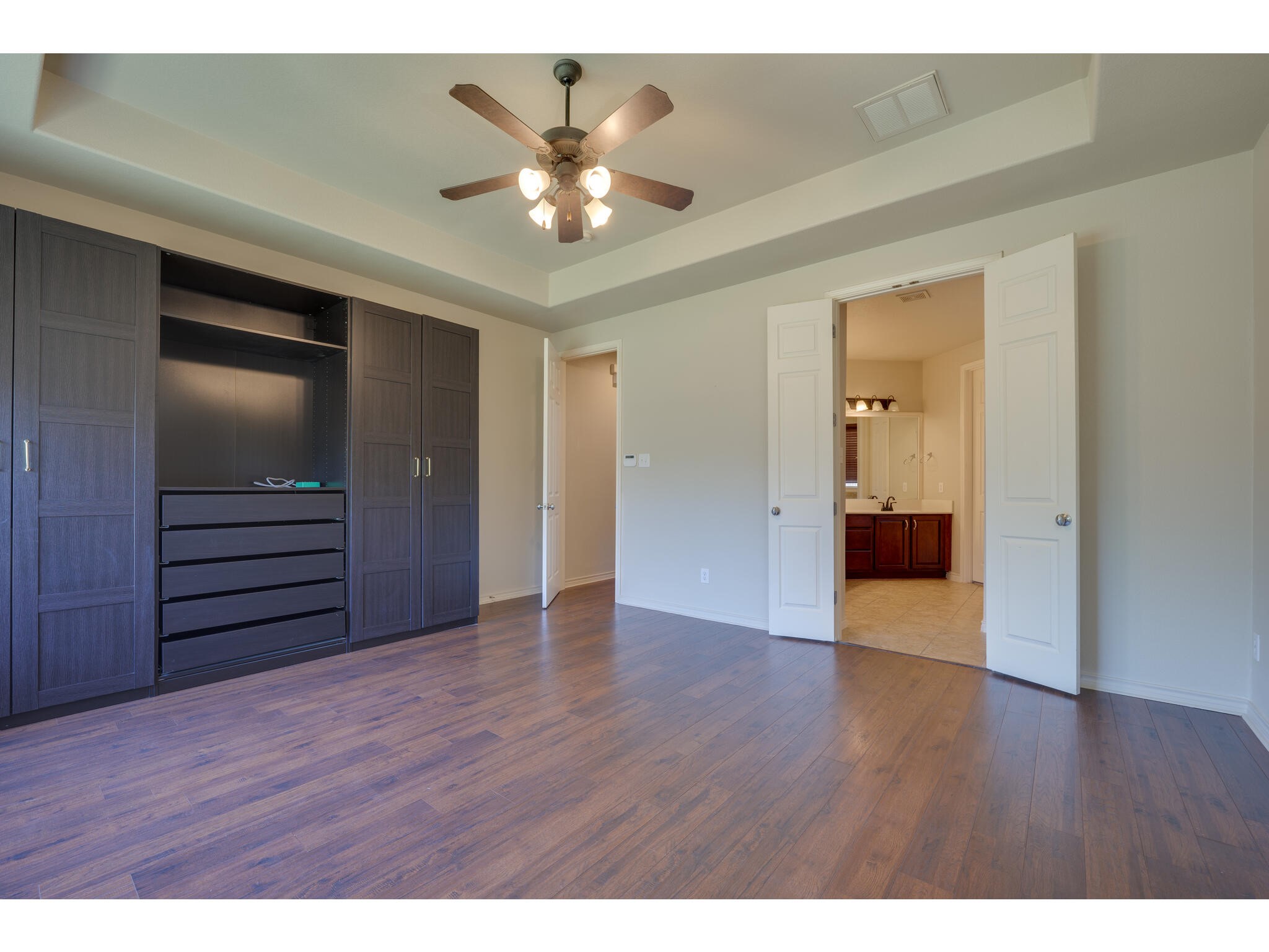 13925 Fallsprings Way Manor, TX 78653 - Photo 23 of 39 a view of an empty room with wooden floor