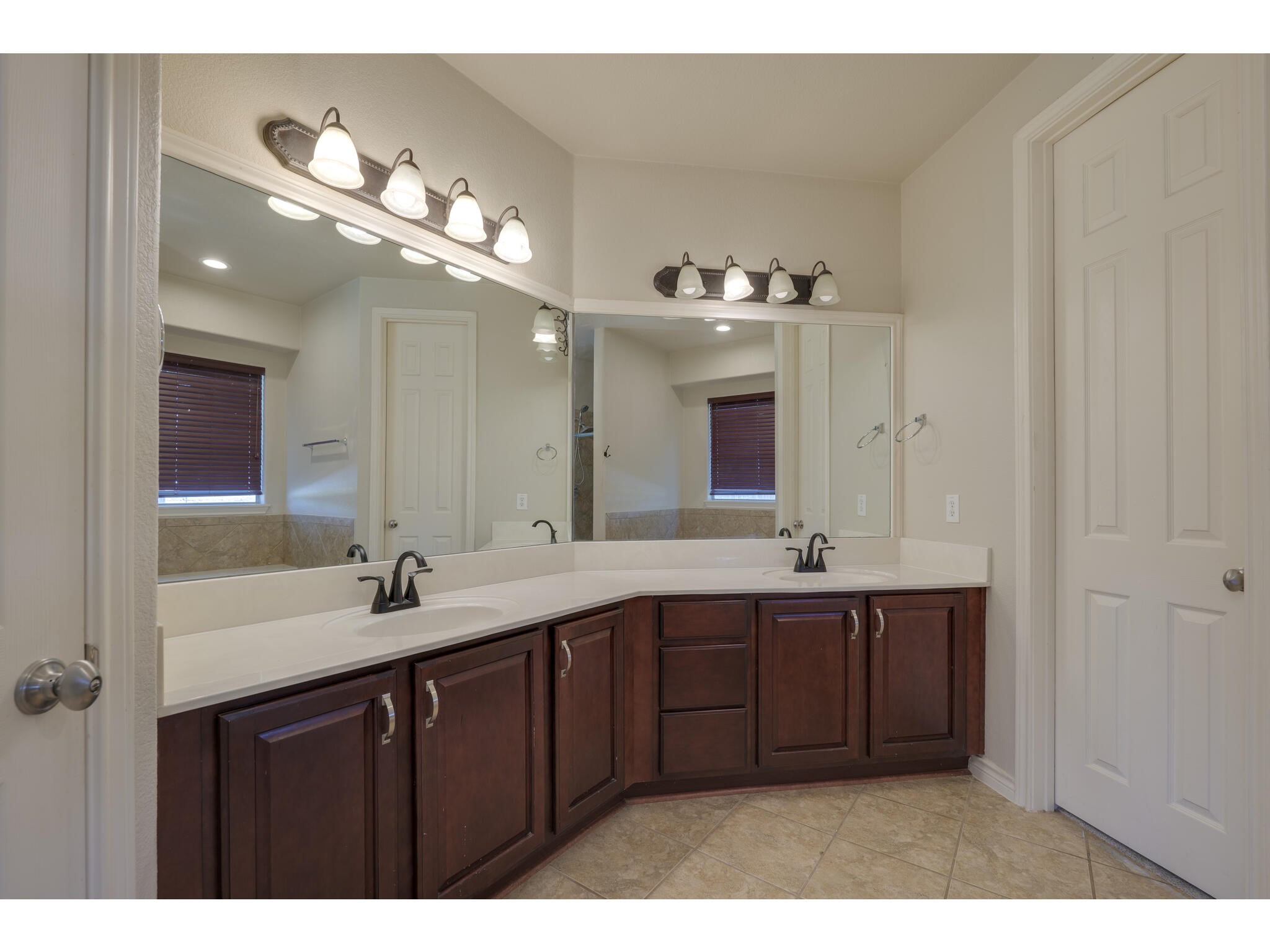 13925 Fallsprings Way Manor, TX 78653 - Photo 24 of 39 a bathroom with a sink and a mirror