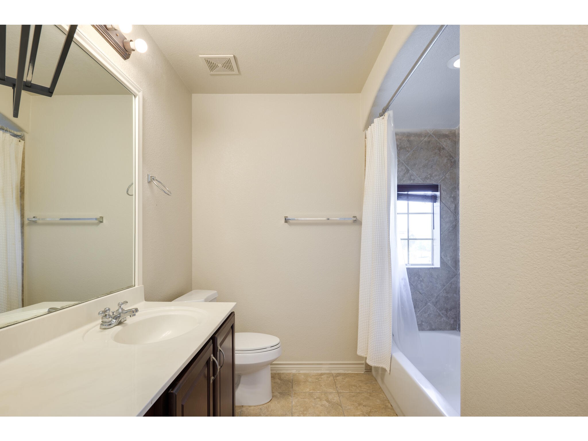 13925 Fallsprings Way Manor, TX 78653 - Photo 32 of 39 a bathroom with a sink a toilet and shower