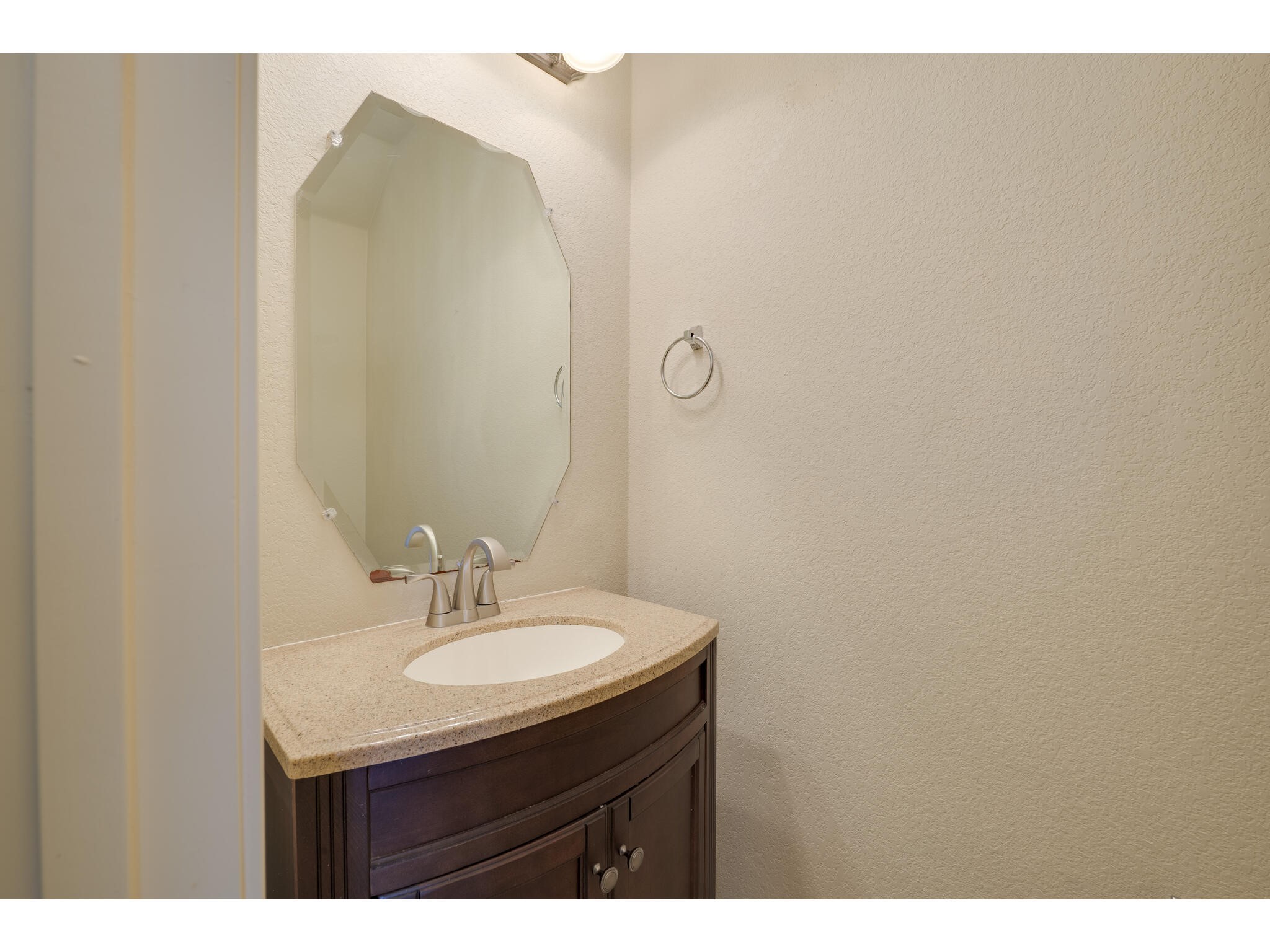 13925 Fallsprings Way Manor, TX 78653 - Photo 35 of 39 a bathroom with a sink and a mirror