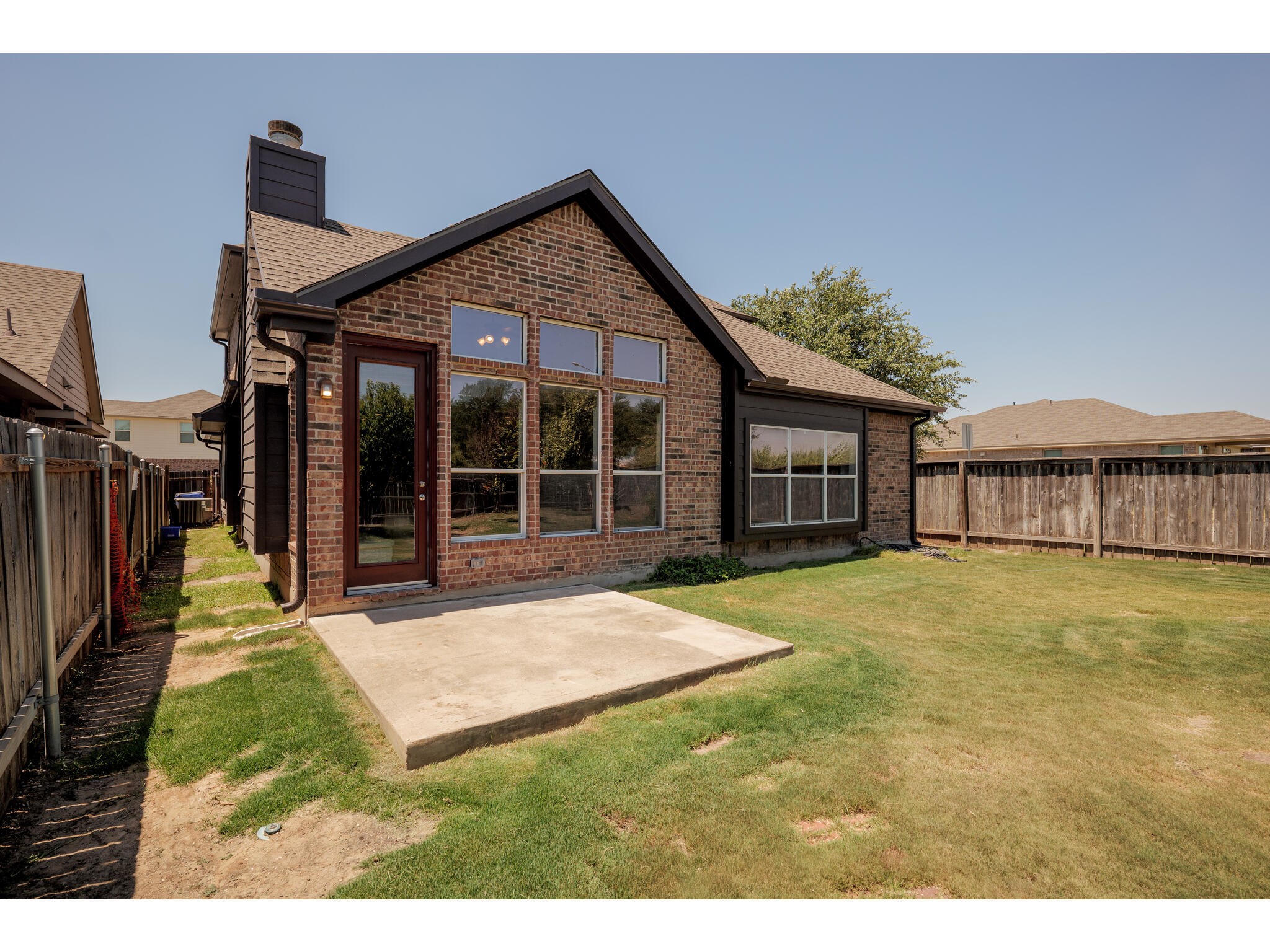 13925 Fallsprings Way Manor, TX 78653 - Photo 37 of 39 a view of a house with a yard and sitting area