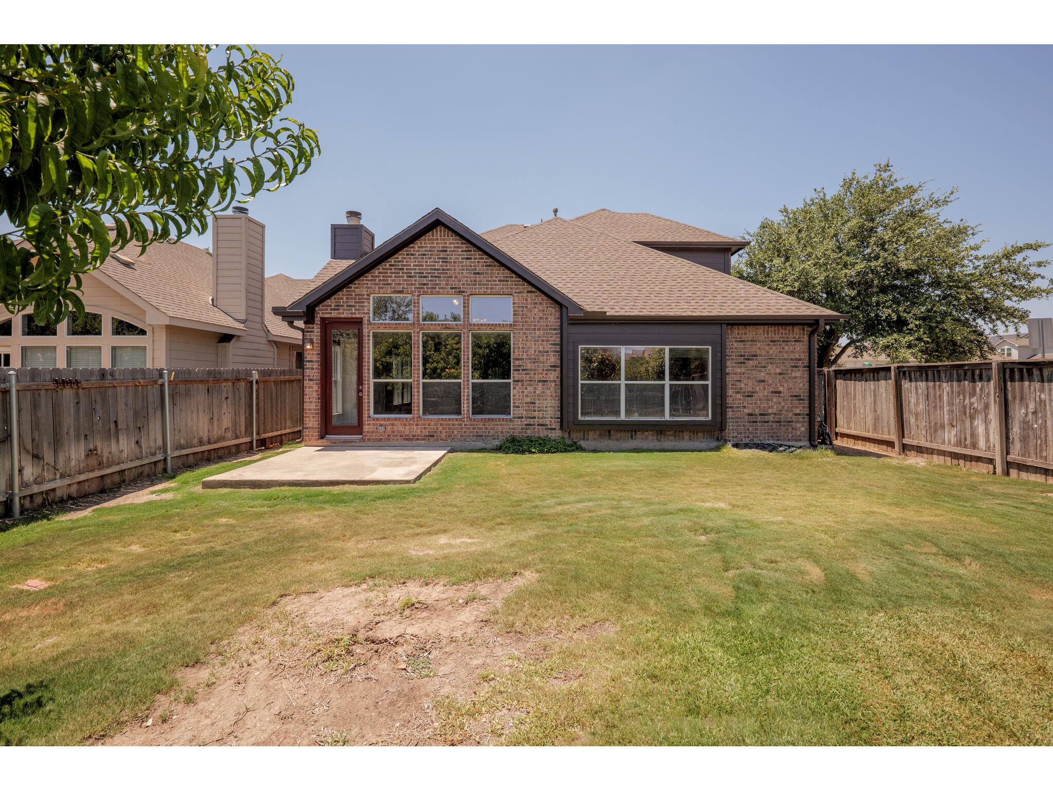 13925 Fallsprings Way Manor, TX 78653 - Photo 39 of 39 a front view of a house with a garden