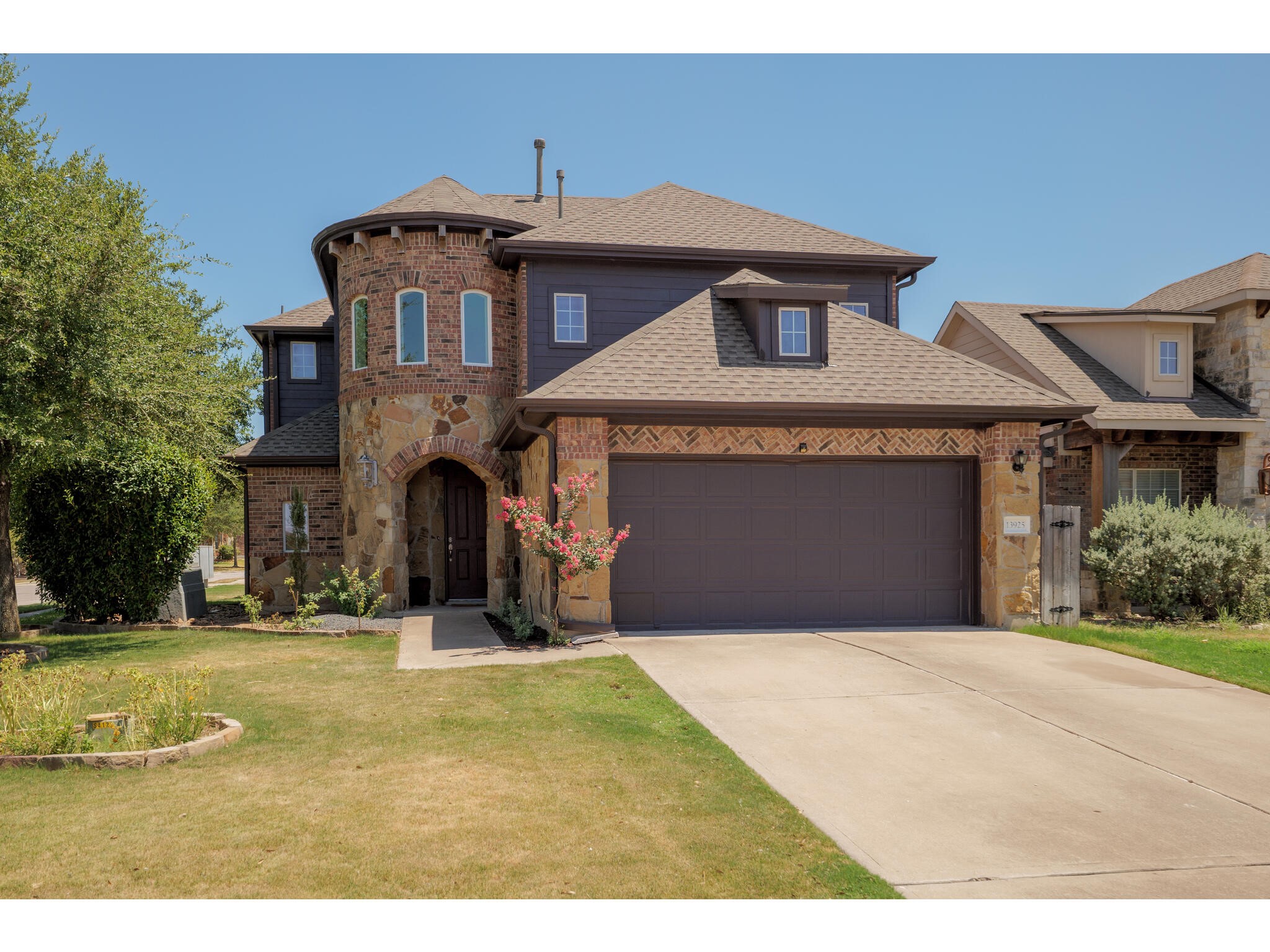 13925 Fallsprings Way Manor, TX 78653 - Photo 8 of 39 a front view of a house with a yard