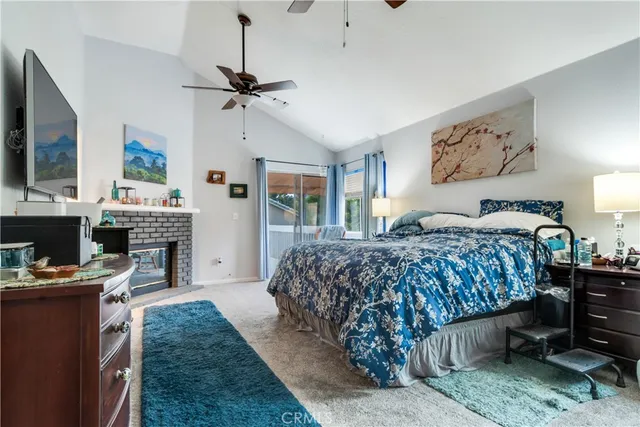 a bedroom with a bed and a fireplace