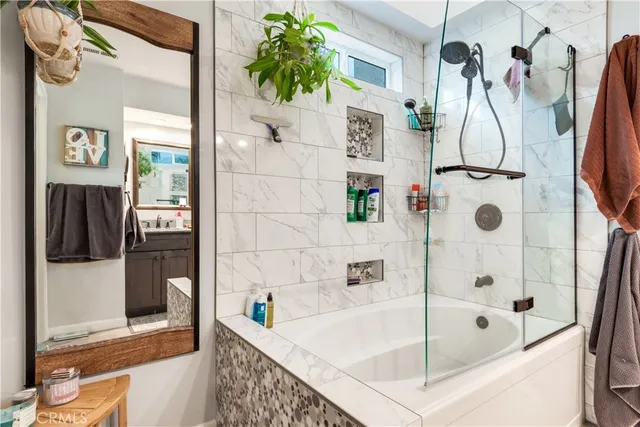 a bathroom with a tub and shower