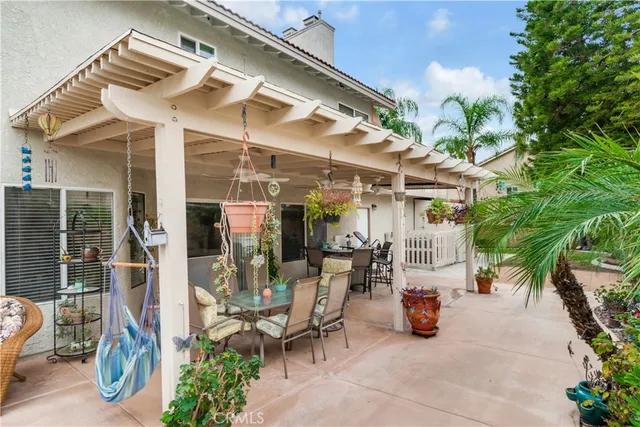 a view of a chairs and table in a patio