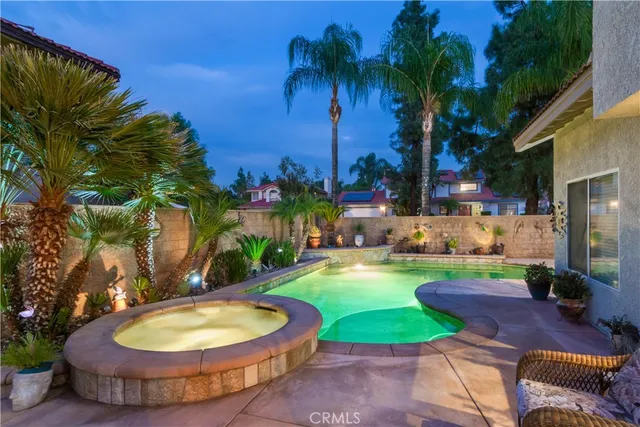 a view of a backyard with plants and patio