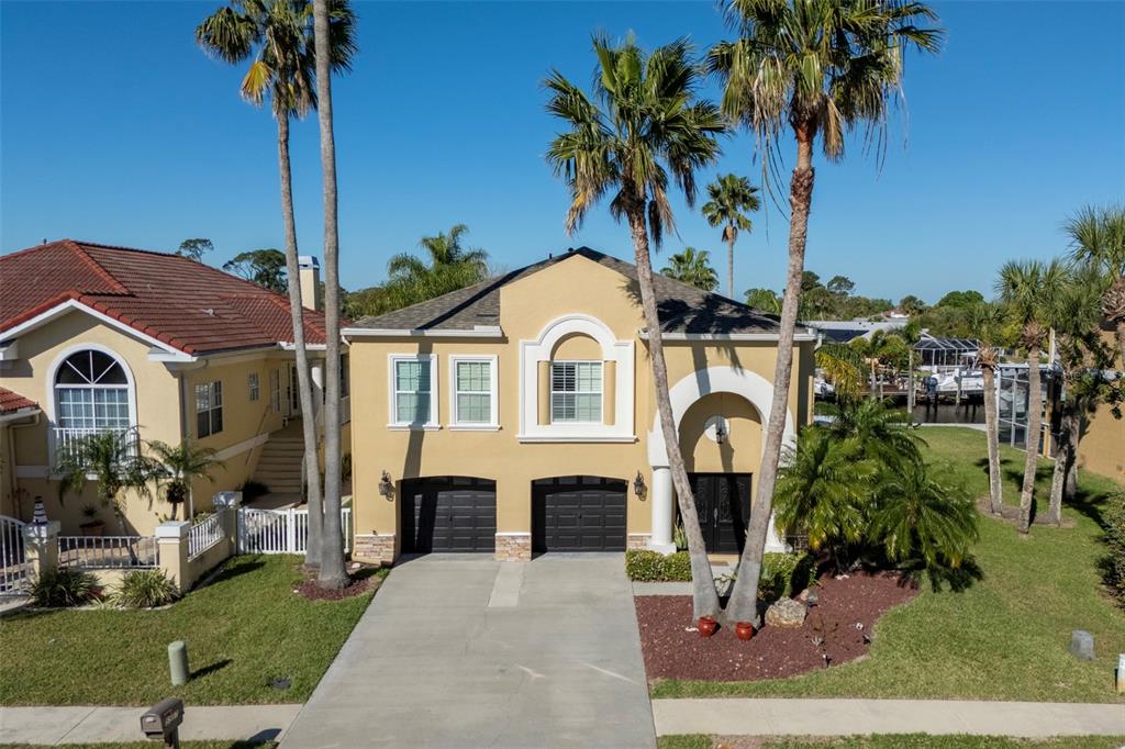 a front view of a house with garden