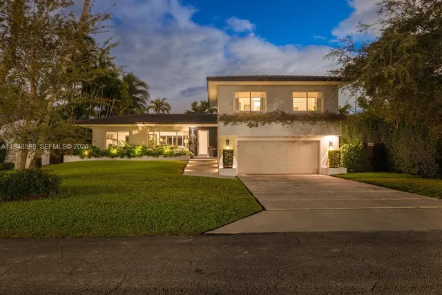 a view of a patio with table and chairs and potted plants