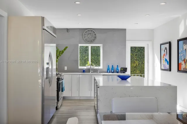 a view of a swimming pool with a patio and a yard