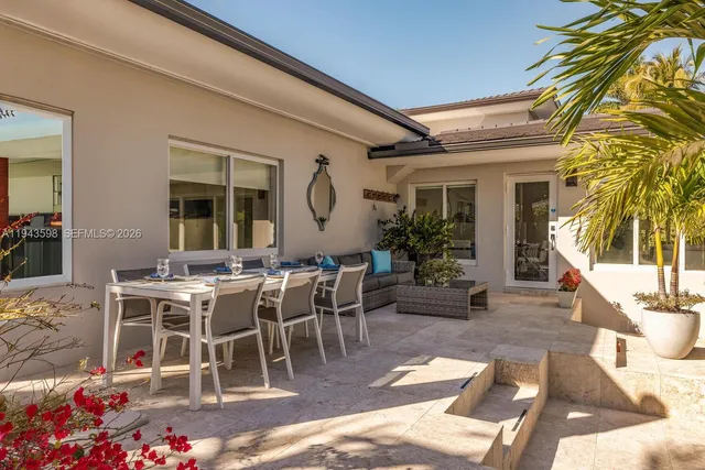 a view of swimming pool with sitting area
