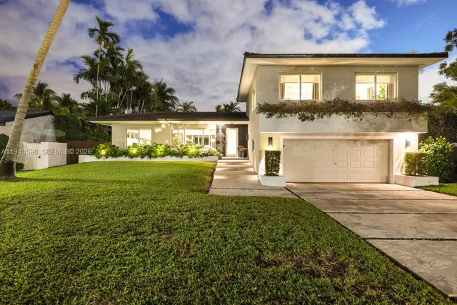 an aerial view of residential houses with swimming pool