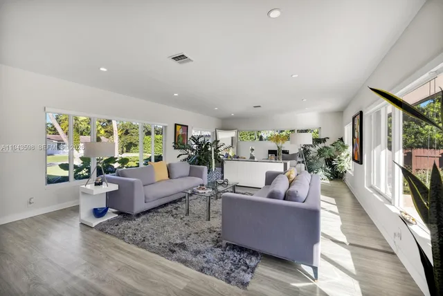 a kitchen with a refrigerator and a sink
