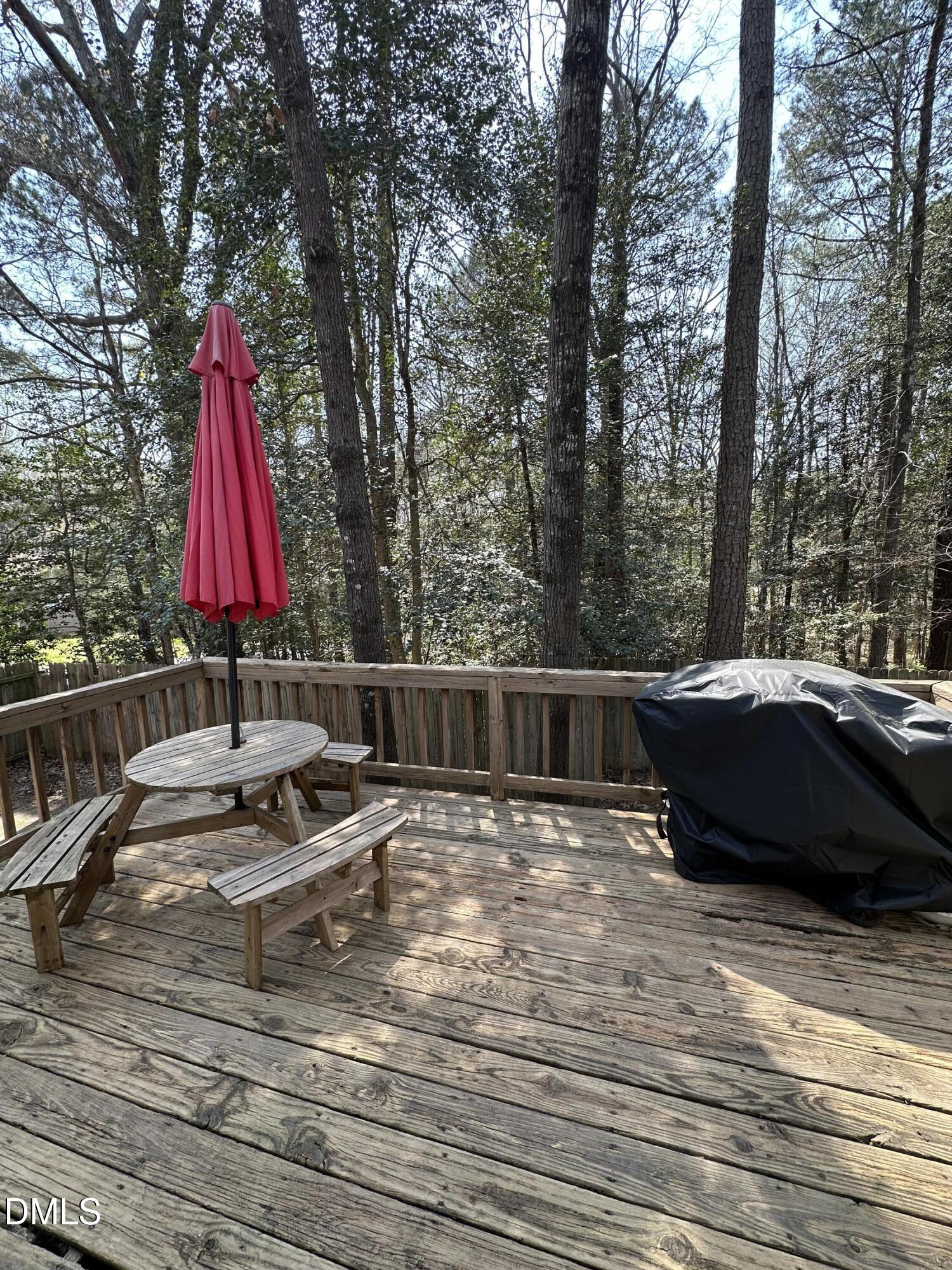 2301 Ruddy Road Raleigh, NC 27616 - Photo 15 of 17 a view of swimming pool with a lounge chairs and wooden fence