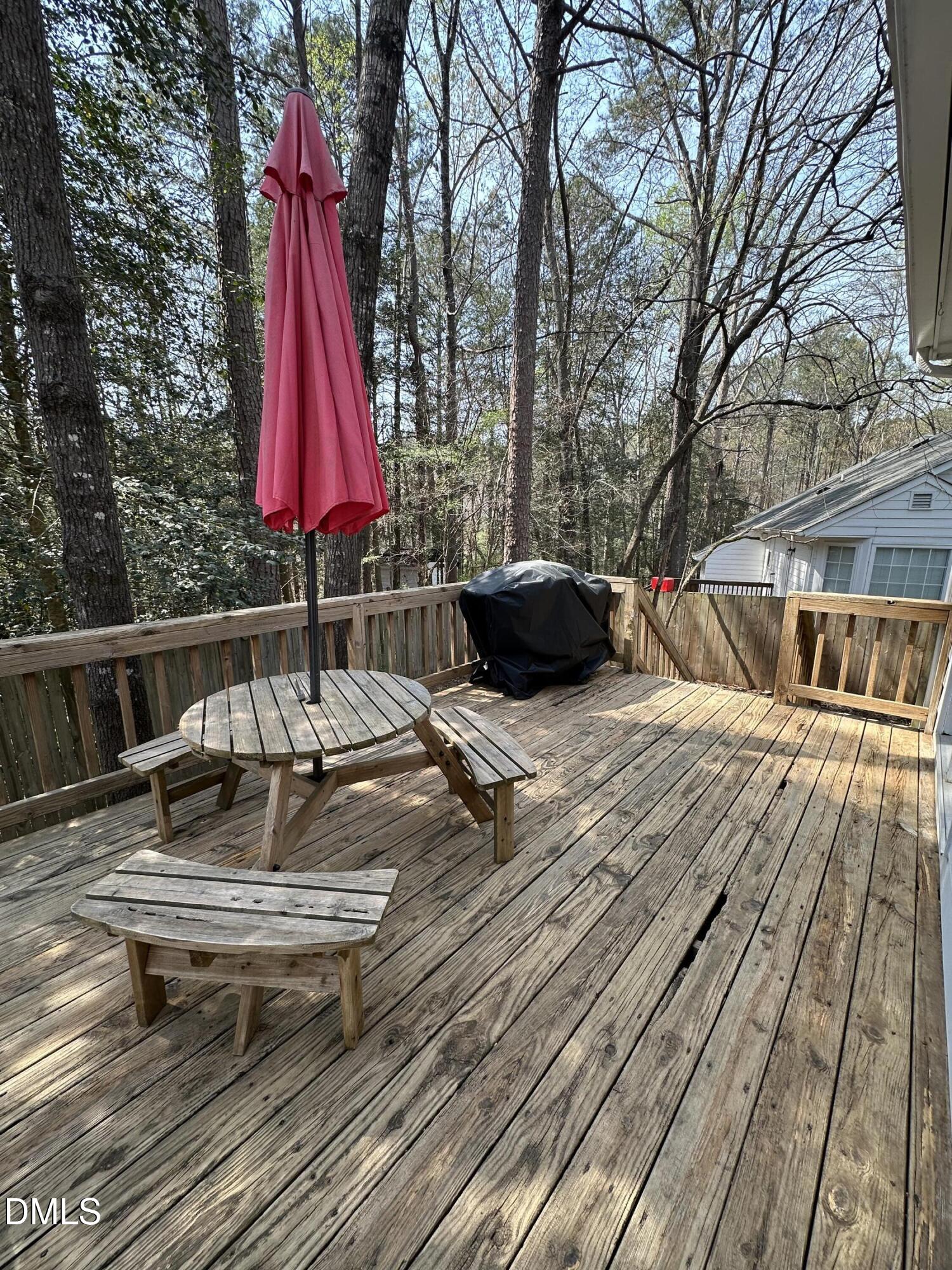 2301 Ruddy Road Raleigh, NC 27616 - Photo 16 of 17 a view of sitting area with chairs and wooden fence