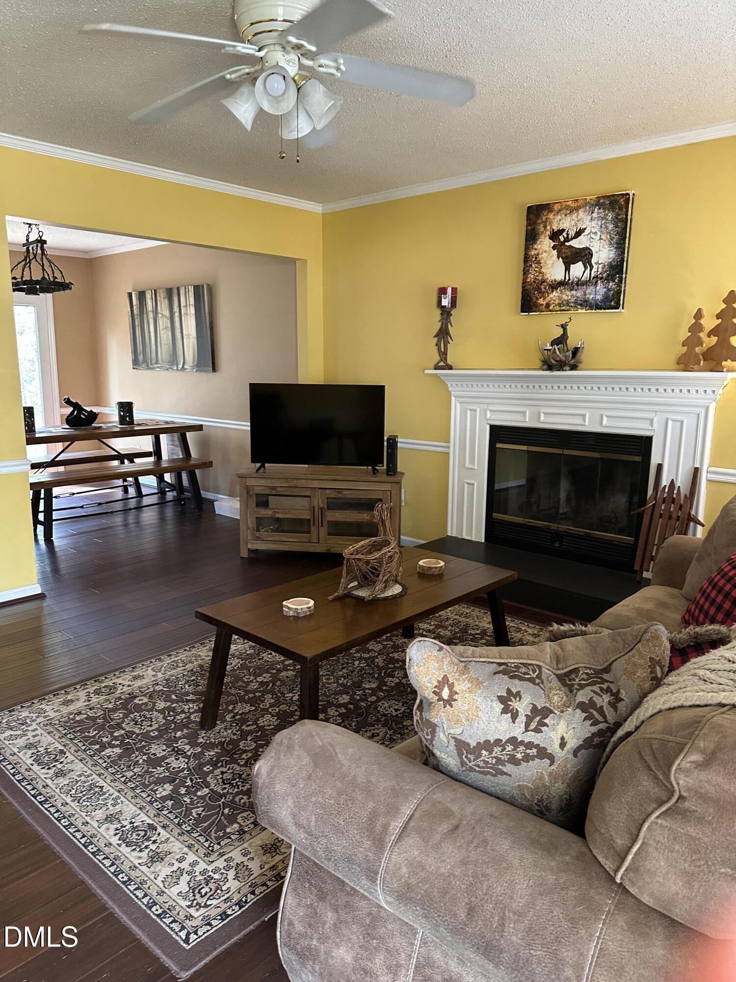 2301 Ruddy Road Raleigh, NC 27616 - Photo 3 of 17 a living room with furniture and a fireplace