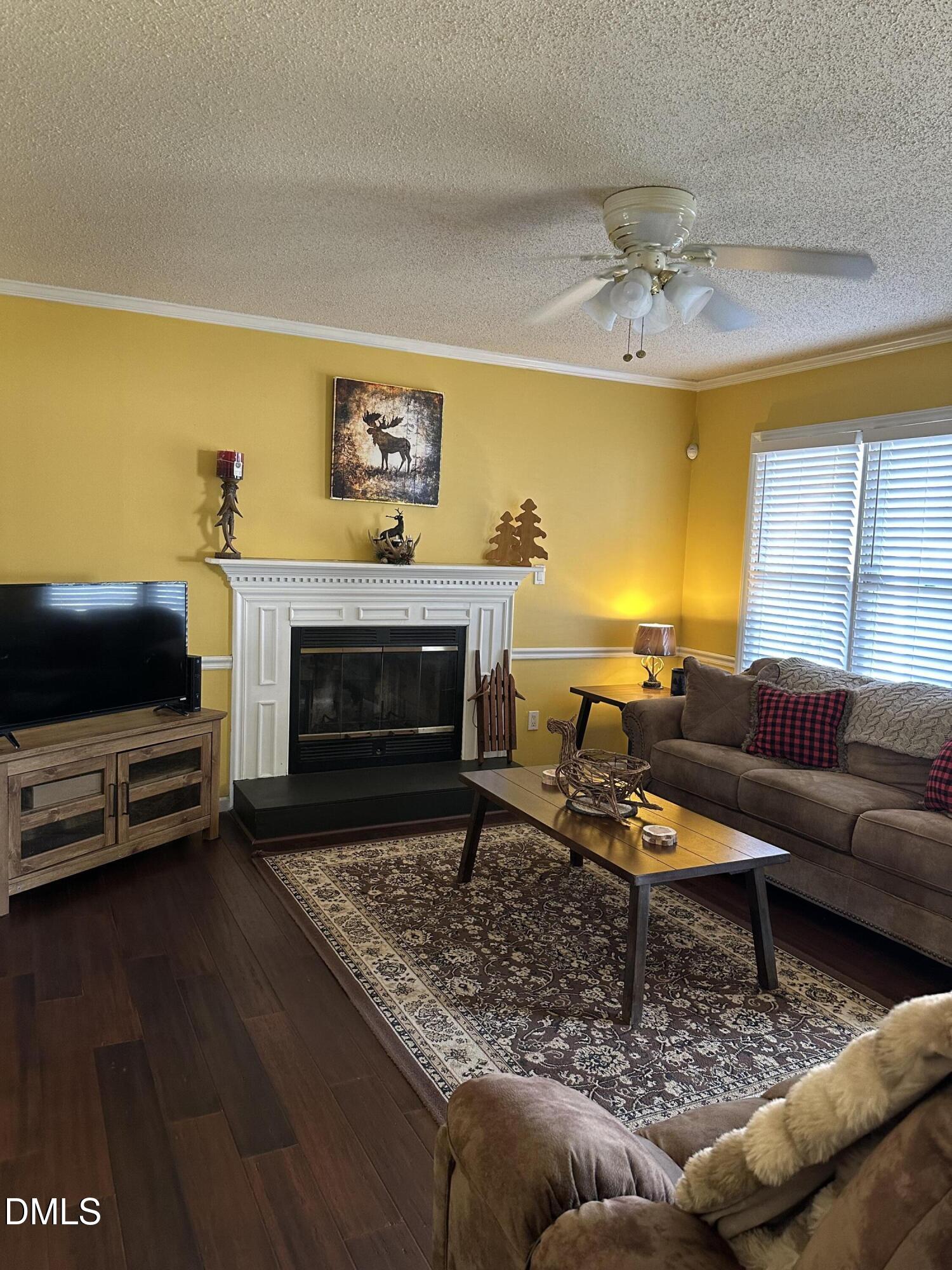 2301 Ruddy Road Raleigh, NC 27616 - Photo 4 of 17 a living room with furniture and a fireplace