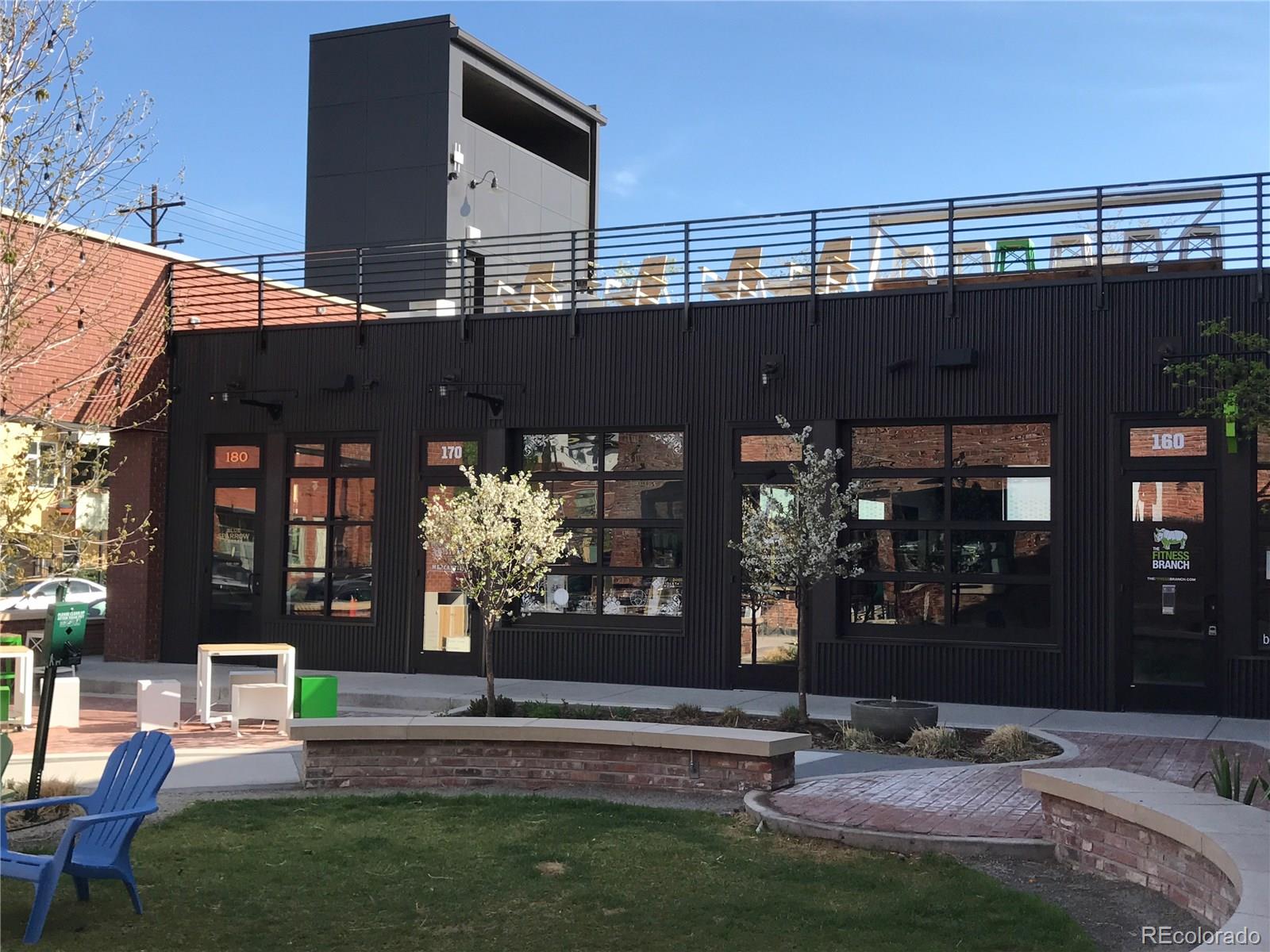 3101 Blake Street, Unit 214 Denver, CO 80205 - Photo 16 of 17 a view of house with outdoor space and patio