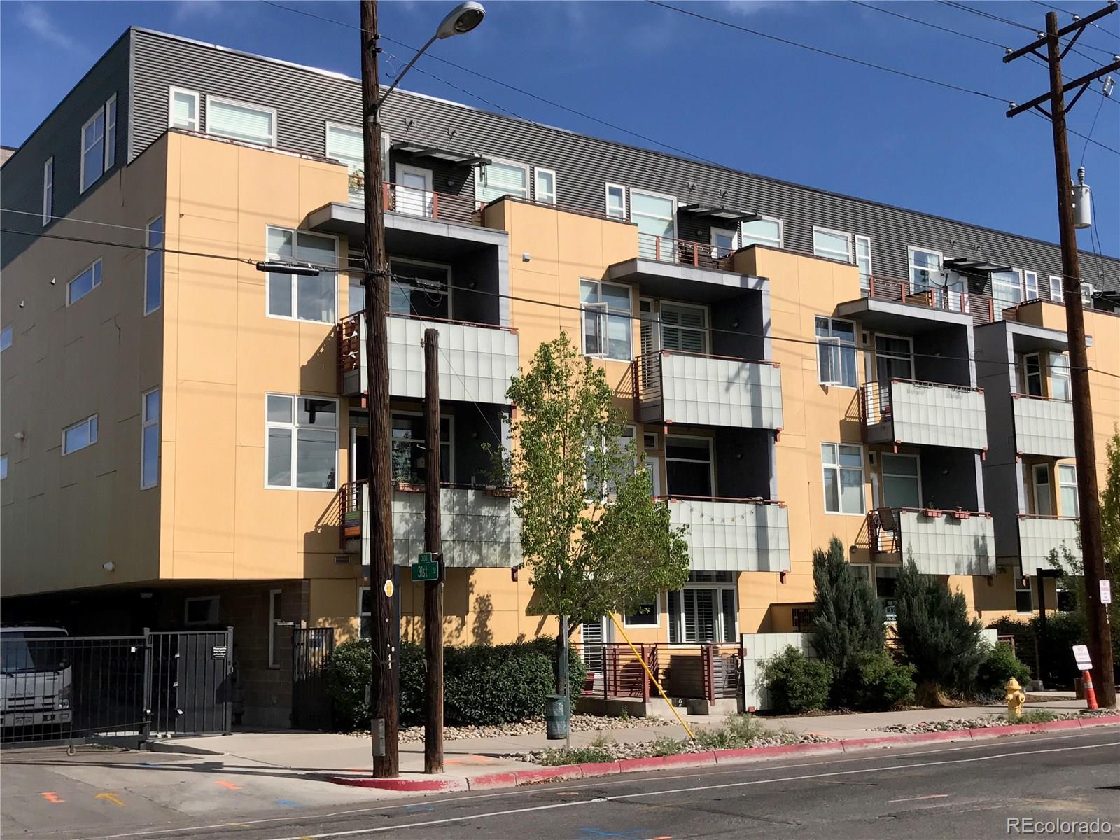 3101 Blake Street, Unit 214 Denver, CO 80205 - Photo 2 of 17 a front view of a building with street