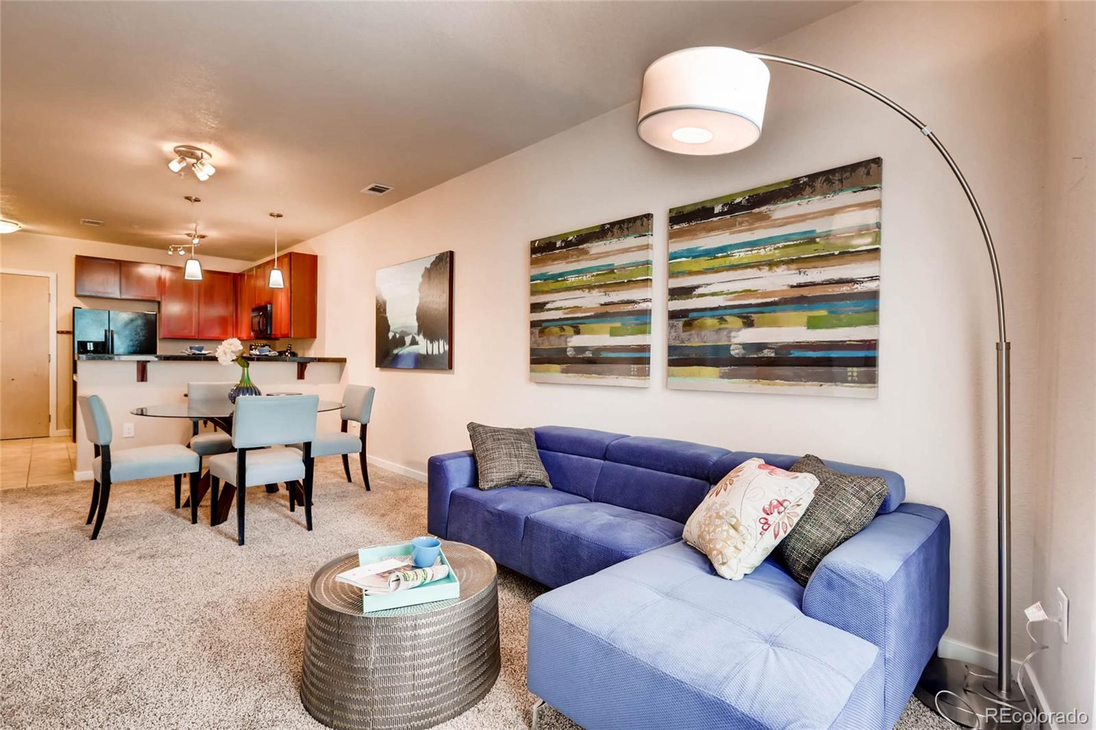 3101 Blake Street, Unit 214 Denver, CO 80205 - Photo 3 of 17 a living room with furniture and a view of kitchen