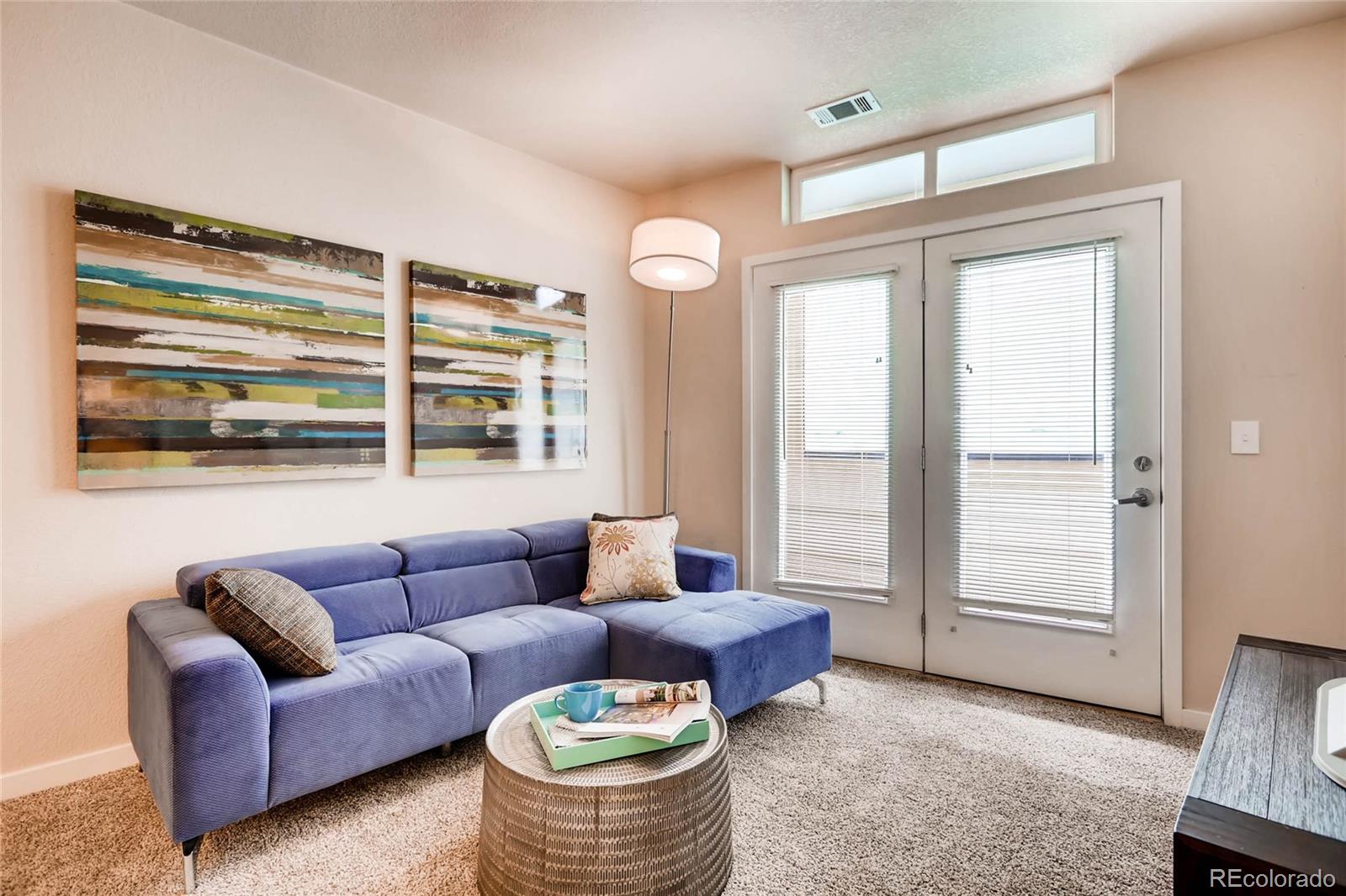 3101 Blake Street, Unit 214 Denver, CO 80205 - Photo 4 of 17 a living room with furniture and a window